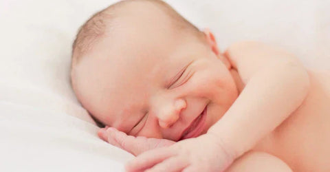 Why Does Your Baby Laugh And Smile In Sleep?