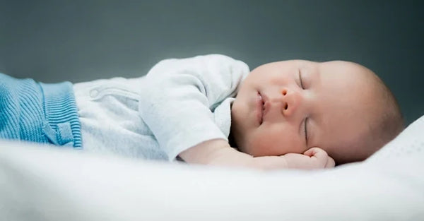 How Newborn Sleep Cycles Work & How Swaddling Can Help